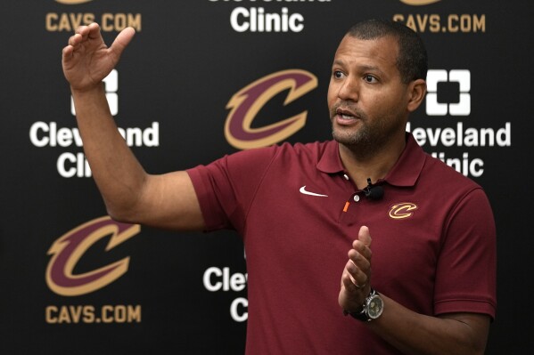 Koby Altman, president of basketball operations for the Cleveland Cavaliers, answers a question at a news conference in Brecksville, Ohio, Friday, May 24, 2024. (AP Photo/Sue Ogrocki)