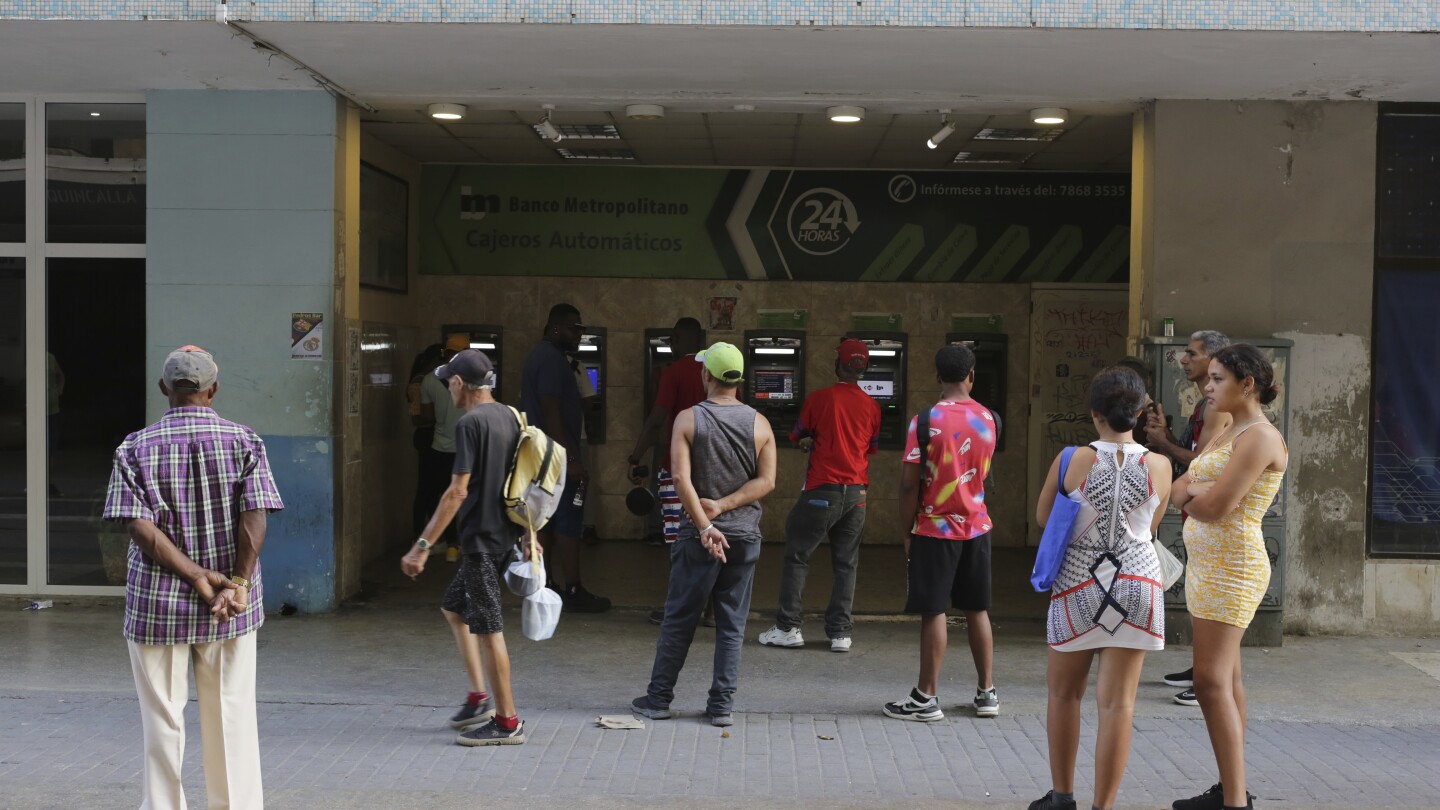Long lines form and frustration grows as Cuba runs out of cash