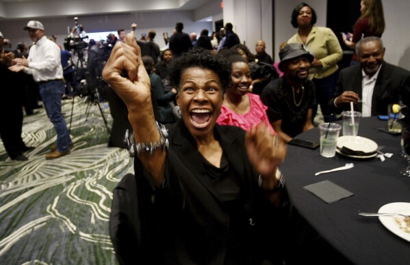 Ruthie Mandigo cheers during an election results watch party for Henry Whitehorn, a candidate for Caddo Parish sheriff, Saturday evening, March 23, 2024, at Hilton Shreveport, in La. (Henrietta Wildsmith/The Shreveport Times via AP)