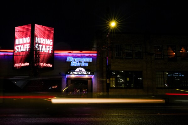 The Dream Girls at SoDo strip club, Monday, Feb. 5, 2024, in Seattle. Adult dancers are defending expenses to pass in the state Legislature that would broaden statewide securities to employees, like having a guard at each club, keypad codes to go into dressing spaces and deescalation training. (AP Photo/Lindsey Wasson)