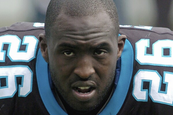 FILE - Carolina Panthers' DeShaun Foster (26) is shown before an NFL football game in Charlotte, N.C., Sunday, Dec. 2, 2007. Former UCLA great DeShaun Foster was named head coach on Monday, Feb. 12, 2024, to take over the program after Chip Kelly left to become offensive coordinator at Ohio State. (AP Photo/Mike McCarn, File)