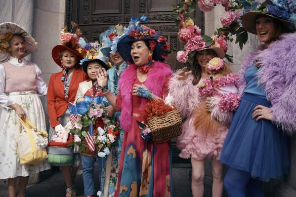 Revelers wearing decorated hats and costumes participate in the annual Easter Parade and Bonnet Festival in front of St. Patrick's Cathedral on Sunday, April 20, 2025, in New York. (AP Photo/Andres Kudacki)