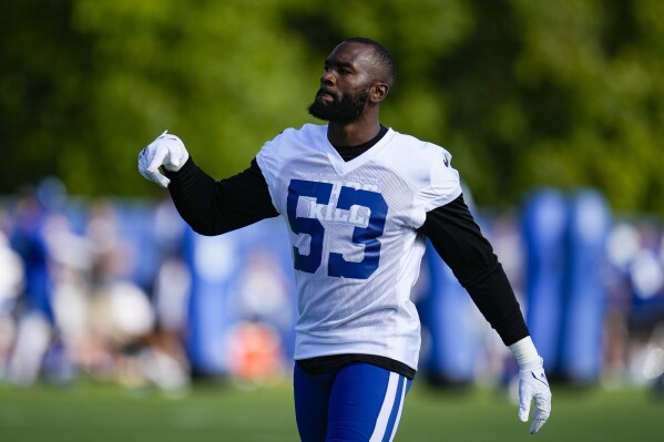 Indianapolis Colts linebacker Shaquille Leonard warms up before practice at NFL team's football training camp in Westfield, Ind., Saturday, July 29, 2023. (AP Photo/Michael Conroy)