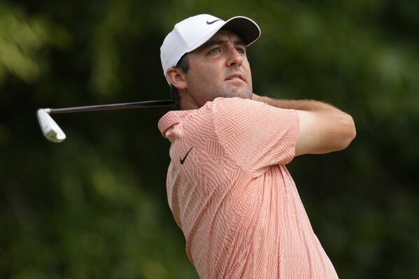 FILE - Scottie Scheffler hits from the third tee during the first round of the Memorial golf tournament, Thursday, June 6, 2024, in Dublin, Ohio. Scheffler will be competing in the U.S. Open next week at Pinehurst No. 2 in Pinehurst, N.C. (AP Photo/Sue Ogrocki, File)