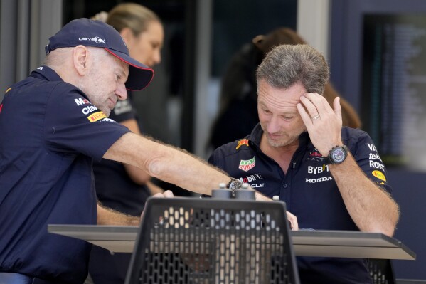 Red Bull team principal Christian Horner, right, has breakfast with Red Bull lead designer Adrian Newey prior to the first practice session ahead of the Formula One Bahrain Grand Prix at the Bahrain International Circuit in Sakhir, Bahrain, Thursday, Feb. 29, 2024. (AP Photo/Darko Bandic)