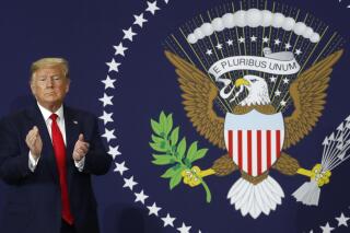 President Donald Trump claps after speaking at Dana Incorporated, Thursday, Jan. 30, 2020, in Warren, Mich., about the new North American trade agreement. (AP Photo/Paul Sancya)