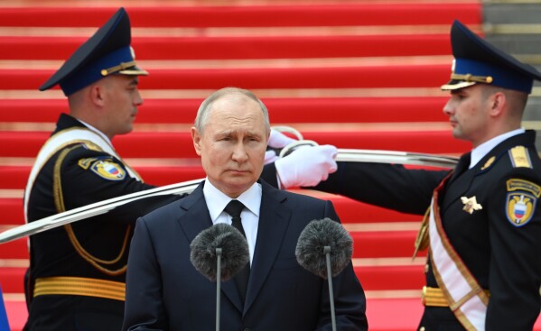 FILE - Russian President Vladimir Putin arrives to address units of the Defense Ministry, the National Guard, the Interior Ministry, the Federal Security Service and the Federal Guard Service at the Kremlin, in Moscow, Russia, Tuesday, June 27, 2023. (Sergei Guneyev, Sputnik, Kremlin Pool Photo via AP, File)