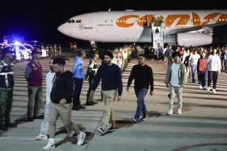 Venezuelan migrants deported from the United States arrive at Simon Bolivar International Airport in Maiquetia, Venezuela, Monday, March 24, 2025. (AP Photo/Ariana Cubillos)
