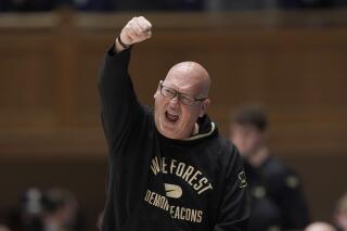 FILE - Wake Forest head coach Steve Forbes reacts during the first half of an NCAA college basketball game against Duke in Durham, N.C., Tuesday, Feb. 15, 2022. Wake Forest says second-year coach Steve Forbes has signed what it calls a “long-term” contract extension as he has led a rapid rise for the long-struggling Demon Deacons program. The school announced the deal Monday, March 7, 2022, the same day the Atlantic Coast Conference announced Forbes was its choice as league coach of the year. (AP Photo/Gerry Broome, File)