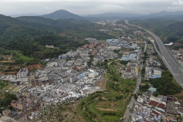 In this photo provided by China's Xinhua News Agency, an aerial view shows damaged buildings in the aftermath of a tornado in Guangming Village of Zhongluotan Town, Baiyun District, Guangzhou, south China's Guangdong Province, Sunday, April 28, 2024. Aerial photos posted by Chinese state media on Sunday showed the wide devastation of a part of the southern city of Guangzhou after a tornado swept through the day before, killing and injuring dozens of people and damaging over a hundred buildings. (Deng Hua/Xinhua via AP)