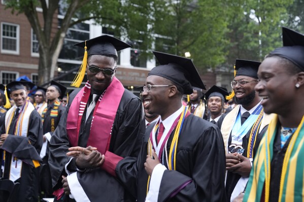 Graduating students arrive at the Morehouse College commencement before President Joe Biden speaks, Sunday, May 19, 2024, in Atlanta. (AP Photo/Alex Brandon)