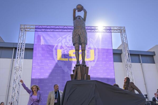 Seimone Augustus, right, a former LSU player who lead her team to multiple final fours and a Minnesota Lynx player who won four WNBA Championships, unveils her statue with LSU head coach Kim Mulkey, left, at the LSU campus on Sunday, Jan. 15, 2023, in Baton Rouge, La. (AP Photo/Matthew Hinton)