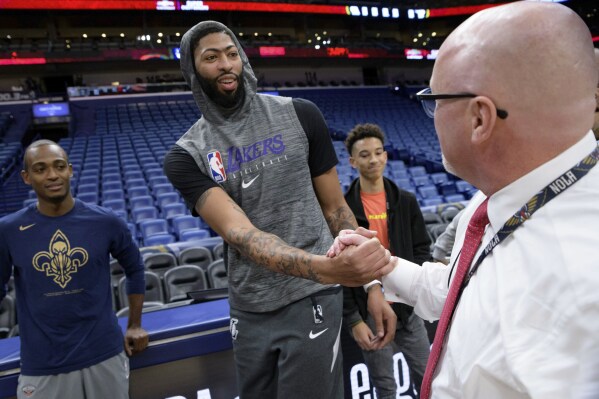 Los Angeles Lakers forward Anthony Davis greets New Orleans Pelicans Executive Vice President of Basketball Operations David Griffin before an NBA basketball game in New Orleans, Wednesday, Nov. 27, 2019. The Pelicans have opted to wait until 2025 to use the last of the three first-round draft choices they received from the Lakers as part of the 2019 Anthony Davis trade, a person familiar with the decision told The Associated Press, Saturday, June 1, 2024. (AP Photo/Matthew Hinton, File)