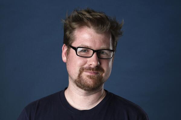 FILE - Justin Roiland poses for a portrait to promote the television series "Rick and Morty" on day two of Comic-Con International, July 21, 2017, in San Diego. Roiland, who created the animated series “Rick and Morty” and provides the voices of the two title characters, is awaiting trial on charges of felony domestic violence against a former girlfriend. A criminal complaint obtained Thursday, Jan. 12, 2023, by The Associated Press from prosecutors in Orange County, Calif., detailed the charges against him. (Photo by Chris Pizzello/Invision/AP, File)