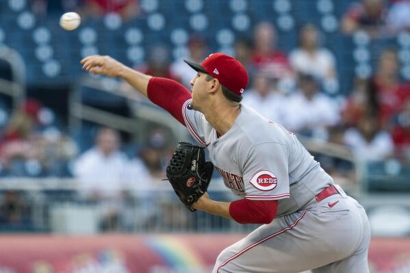 Cincinnati Reds' Kyle Farmer is hit by a pitch during the seventh inning of  the team's baseball game against the Washington Nationals in Washington,  Tuesday, May 25, 2021. (AP Photo/Manuel Balce Ceneta