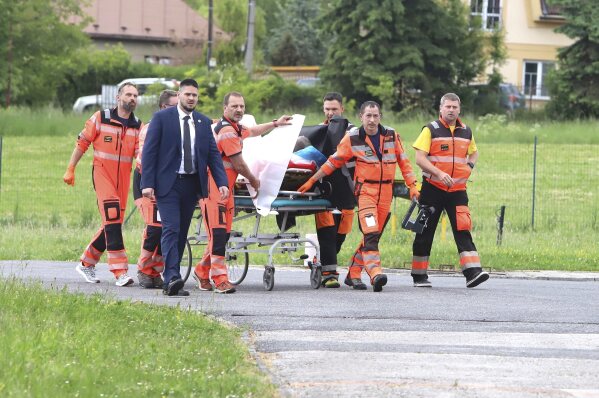 Rescue workers wheel Slovak Prime Minister Robert Fico, who was shot and injured, to a hospital in the town of Banska Bystrica, central Slovakia, Wednesday, May 15, 2024. (Jan Kroslak/TASR via AP)
