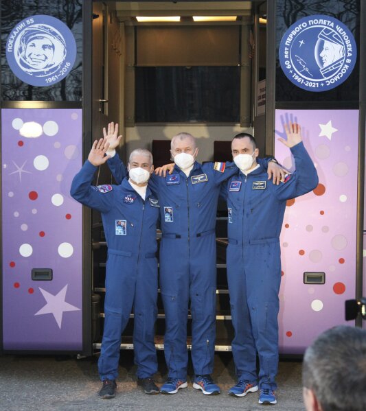 In this photo released by the Roscosmos Space Agency, from left, U.S. astronaut Mark Vande Hei, Russian cosmonauts Oleg Novitsky and Pyotr Dubrov, members of the main crew to the International Spac...