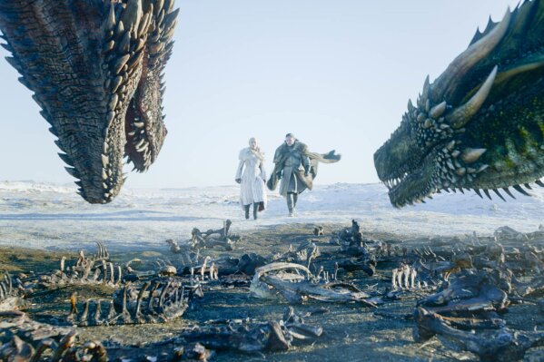 
              This image released by HBO shows  Emilia Clarke, left, and Kit Harington in a scene from "Game of Thrones," premiering on Sunday, April 14. The first episode of the final season of "Game of Thrones" is a record-breaker for the series and HBO. The pay channel said the 17.4 million viewers who watched Sunday’s episode either on TV or online represent a season-opening high for the fantasy saga. (HBO via AP)
            