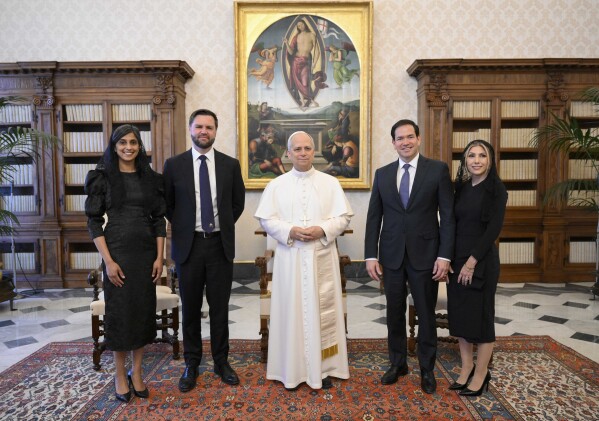 Pope Leo XIV stands for a family photo with the Vice President JD Vance from left, his wife Usha Vance, Foreign Minister Marco Rubio, and his wife Jeanette Dousdebes Rubio, on the occasion of their meeting in the Vatican, on Monday, May 19, 2025, Vatican media about AP).