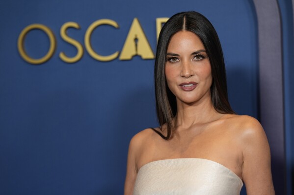 FILE - Olivia Munn arrives at the Governors Awards on Tuesday, Jan. 9, 2024, at the Dolby Ballroom in Los Angeles. When Munn revealed in March 2024 that she was diagnosed with breast cancer and had a double mastectomy, she urged people to ask their doctors to figure out their score on a breast cancer risk calculator, a questionnaire on the National Cancer Institute’s website that is designed for health care providers to use with patients. (AP Photo/Chris Pizzello, File)