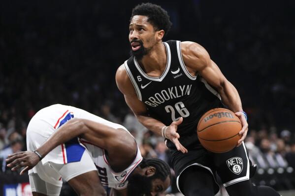 Brooklyn Nets' Spencer Dinwiddie (26) drives past Philadelphia 76ers' James Harden during the second half of Game 4 in an NBA basketball first-round playoff series Saturday, April 22, 2023, in New York. (AP Photo/Frank Franklin II)