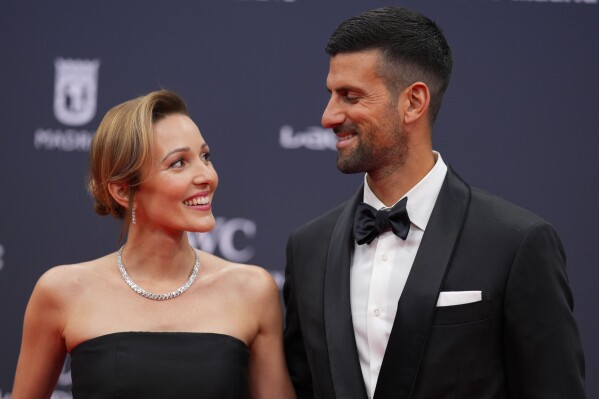Serbian tennis player Novak Djokovic, right, and Jelena Ristic pose on the red carpet before the Laureus Sports Awards ceremony in Madrid, Monday, April 22, 2024. (AP Photo/Manu Fernandez)