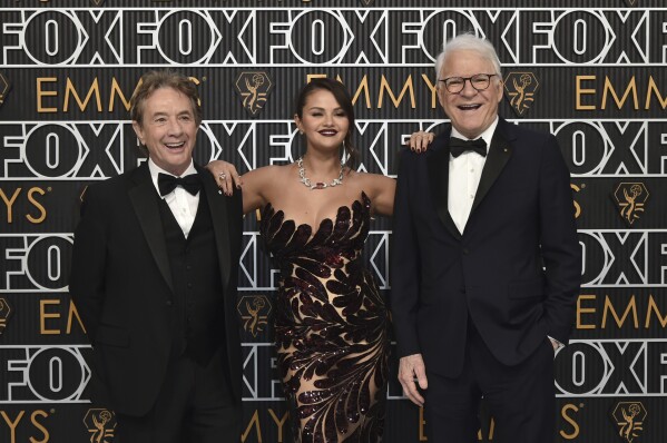 Martin Short, from left, Selena Gomez, and Steven Martin arrive at the 75th Primetime Emmy Awards on Monday, Jan. 15, 2024, at the Peacock Theatre in Los Angeles. (Photo by Richard Shotwell/Invision/AP)