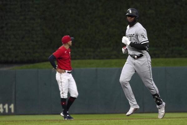 Chicago White Sox's Luis Robert, right, runs the bases on a grand slam off Minnesota Twins pitcher Sonny Gray during the fourth inning of a baseball game, Thursday, July 14, 2022, in Minneapolis. (AP Photo/Jim Mone)