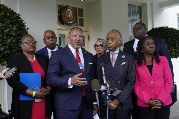 FILE - Marc Morial, center, President and Chief Executive Officer of the National Urban League, talks with reporters outside the West Wing of the White House in Washington, July 8, 2021, following a meeting with President Joe Biden and leadership of top civil rights organizations. Extreme views adopted by some local, state and federal political leaders who try to limit what history can be taught and undermine how Black leaders perform their jobs are among the leading threats to democracy for Black Americans, according to a National Urban League report to be released Saturday, April 15. (AP Photo/Susan Walsh, File)