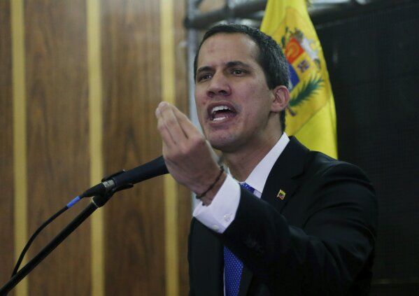 
              Venezuela's opposition leader and self-proclaimed interim president Juan Guaidó speaks during a meeting with the  Chamber of Commerce, in Caracas, Venezuela, Thursday, May 16, 2019. Guaidó referred to the Norwegian initiative, efforts to mediate between the opposition and the government of President Nicolás Maduro, in remarks on Thursday, but said the opposition won't enter into any "false negotiation." (AP Photo/Fernando Llano)
            