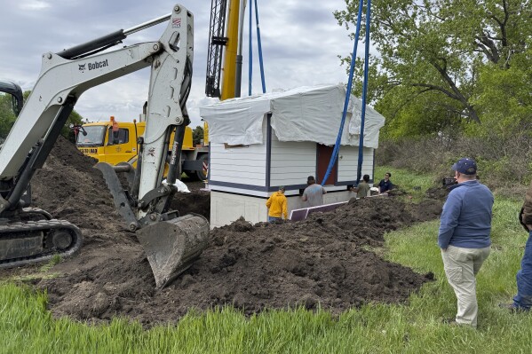 Workers install a restroom at the Welk Homestead State Historic Site near Strasburg, North Dakota, on Friday, May 23, 2025. (Photo by Rob Hanna via AP)