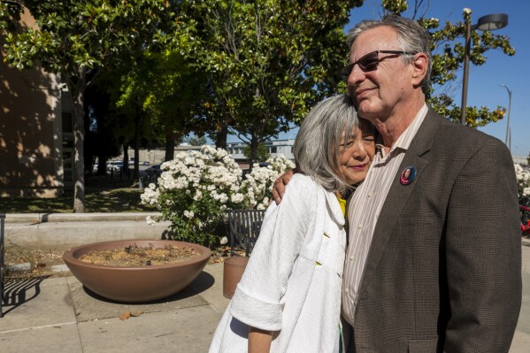 Marc Klaas, father of Polly Klaas, right, hugs his wife Violet outside Santa Clara County Superior Court in San Jose, Calif., Friday, May 31, 2024. A judge declined to recall the capital sentence against Richard Allen Davis, who in 1993 kidnapped and killed 12-year-old Polly Klaas. (AP Photo/Nic Coury)