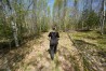 Heather Donahue walks on a rural road, Tuesday, May 13, 2025, in Freedom, Maine. (AP Photo/Robert F. Bukaty)