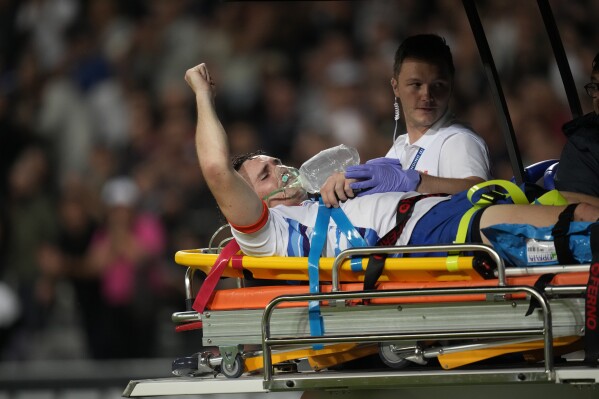 Namibia's Le Roux Malan is taken off the field on a stretcher after getting injured during the Rugby World Cup Pool A match between New Zealand and Namibia at the Stadium de Toulouse in Toulouse, France, Friday, Sept. 15, 2023. (AP Photo/Christophe Ena)