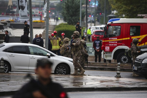 Turkish security forces cordon off an area after an explosion in Ankara, Sunday, Oct. 1, 2023. A suicide bomber detonated an explosive device in the heart of the Turkish capital, Ankara, on Sunday, hours before parliament was scheduled to reopen after a summer recess. A second assailant was killed in a shootout with police. (AP Photo/Ali Unal)