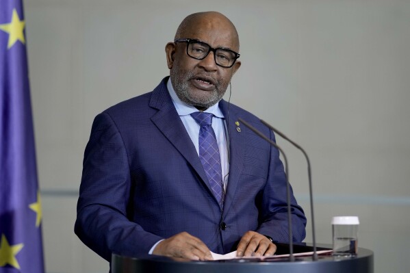 FILE - Comoros' President Azali Assoumani attends a news conference during the G20 Investment Summit - German Business and the CwA Countries on the sidelines of a Compact with Africa in Berlin, Germany, Monday, Nov. 20, 2023. People in the Indian Ocean island nation of Comoros are voting for president in Africa’s first national election of 2024. Incumbent President Azali Assoumani, a former military officer, is expected to win a fourth term amid criticism that he has become increasingly authoritarian and cracked down on his political opposition. Five opposition candidates are standing against Assoumani in Sunday, Jan. 14, 2024's election. (AP Photo/Markus Schreiber, File)