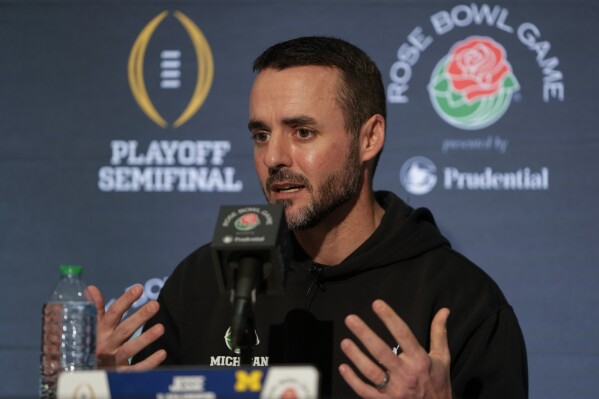 Michigan defensive coordinator Jesse Minter speaks to reporters during a news conference on Thursday, Dec. 28, 2023, in Los Angeles. Michigan is scheduled to play against Alabama on New Year's Day in the Rose Bowl, a semifinal in the College Football Playoff. (AP Photo/Ryan Sun)