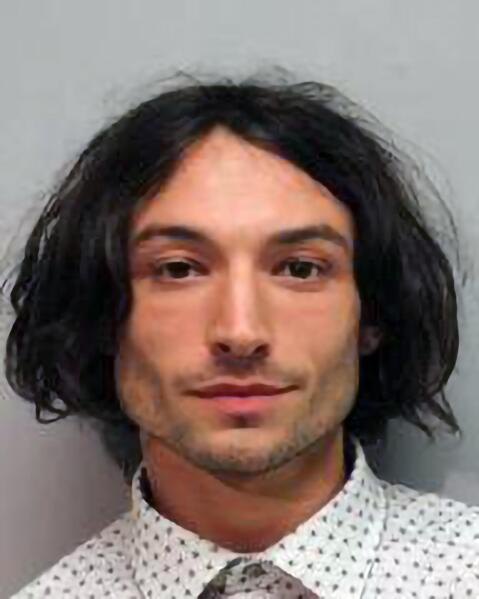 REPLACES HE WITH MILLER - This photo provided by the Hawai'i Police Department shows actor Ezra Miller who was arrested and charged for disorderly conduct and harassment Sunday after an incident at a bar in Hilo. Miller known for playing "The Flash" in "Justice League" films was arrested after an incident at a Hawaii karaoke bar, where police say Miller yelled obscenities, grabbed a mic from a singing woman and lunged at a man playing darts. (Hawai'i Police Department via AP)