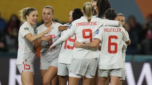 Switzerland players hug after a goal by Seraina Piubel during the second half of the Women's World Cup Group A soccer match between the Philippines and Switzerland in Dunedin, New Zealand, Friday, July 21, 2023. (AP Photo/Alessandra Tarantino)