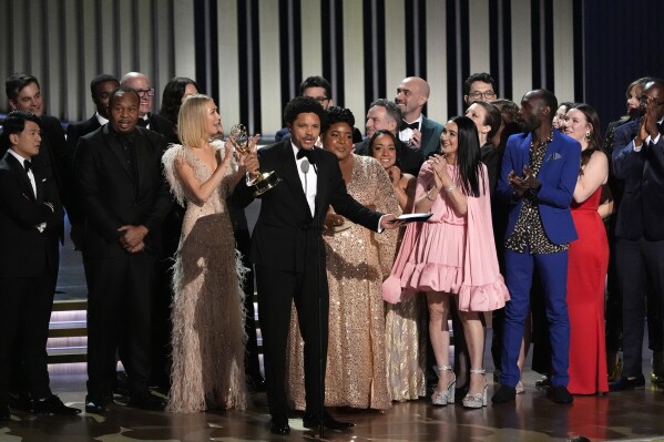 FILE - Trevor Noah, center, and the team from "The Daily Show With Trevor Noah" accept the award for outstanding variety talk series during the 75th Primetime Emmy Awards on Monday, Jan. 15, 2024, at the Peacock Theater in Los Angeles. Noah will host the 2024 Grammy Awards on Feb. 4. (AP Photo/Chris Pizzello, File)