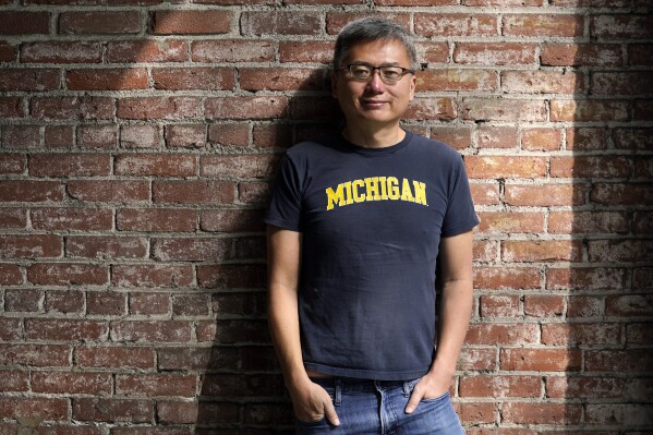 Writer Curtis Chin poses for a portrait to promote his new book "Everything I Learned, I Learned in a Chinese Restaurant: A Memoir," Tuesday, Oct. 10, 2023, in Los Angeles. Chin's memoir, out today, is a candid and sometimes funny reflection on growing up Chinese American in Detroit in the ’70s and ’80s. (AP Photo/Chris Pizzello)