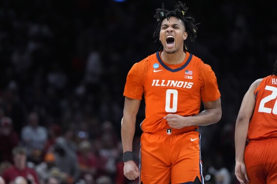 Illinois guard Terrence Shannon Jr. (0) celebrates after a basket against Iowa State during the first half of the Sweet 16 college basketball game in the men's NCAA Tournament, Thursday, March 28, 2024, in Boston. (AP Photo/Michael Dwyer)