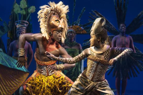 This image released by Disney Theatricals shows Brandon A. McCall as Simba, left, and Pearl Khwezi as Nala during a performance of The Lion King on Broadway in New York on Sept. 14, 2022. The musical turns 25 years old on Broadway this month. (Matthew Murphy/Disney Theatricals via AP)