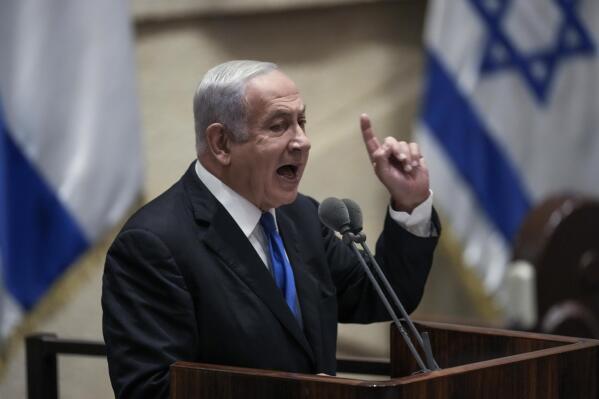 FILE - Former Israeli Prime Minister Benjamin Netanyahu speaks at the Knesset, Israel's parliament, in Jerusalem, June 30, 2022.  Israel is holding its fifth national election in under four years, and once again the race is shaping up as a referendum on  Netanyahu’s fitness to rule.  (AP Photo/Ariel Schalit, File
