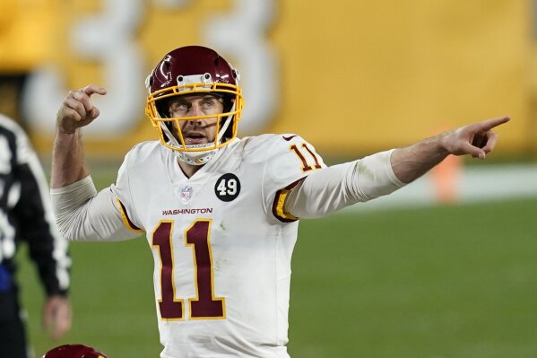 Washington Football Team quarterback Alex Smith (11) calls a play during the second half of an NFL football game against the Pittsburgh Steelers, Monday, Dec. 7, 2020, in Pittsburgh. (AP Photo/Keith Srakocic)