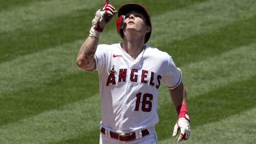 Los Angeles Angels' Mickey Moniak gestures as he scores after hitting a three-run home run during the second inning of a baseball game against the Arizona Diamondbacks Sunday, July 2, 2023, in Anaheim, Calif. (AP Photo/Mark J. Terrill)