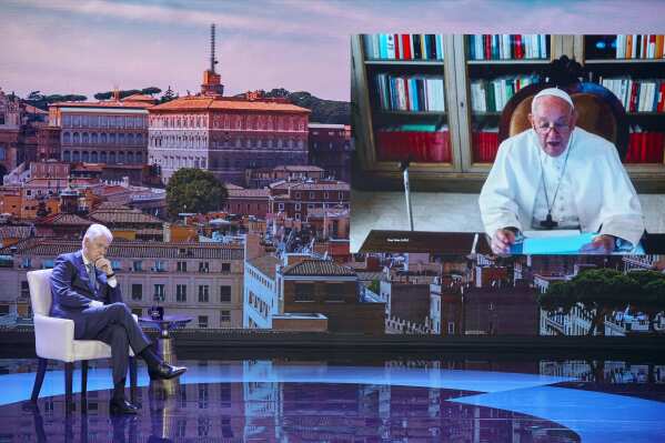 Pope Francis, seen on a screen, right, speaks with former President Bill Clinton, left, through video conference during the Clinton Global Initiative, Monday, Sept. 18, 2023 in New York. Pope Francis urged all people to do their part to address the world’s problems, especially climate change and the care of children, to open The Clinton Global Initiative Monday. CGI announced numerous new programs Monday that it hopes will gather new monetary commitments and engagement, including gender equality and continued support for the people of Ukraine. (AP Photo/Andres Kudacki)