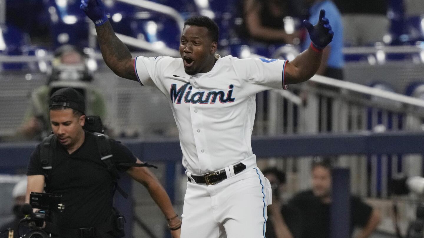 Marlins resume season with 18 new players and a win