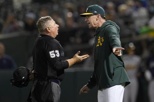 Oakland Athletics manager Bob Melvin, right, reacts after being ejected by umpire Greg Gibson (53) during the sixth inning of a baseball game between the Athletics and the Seattle Mariners in Oakland, Calif., Wednesday, Sept. 22, 2021. (AP Photo/Jeff Chiu)