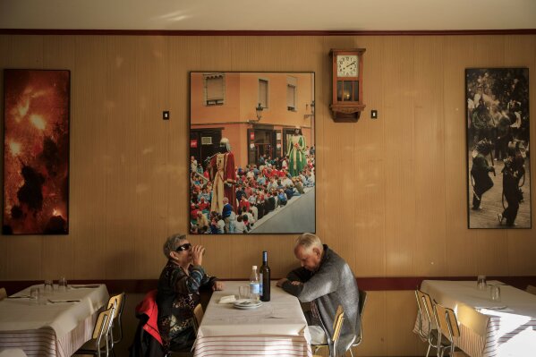
              In this Tuesday Oct. 31, 2017 photo, residents sit in a restaurant in Berga, Spain. Berga, a town with a population of  16,000  near the Pyrenees region of Catalonia, which been one of the epicentres of the pro-independence movement in the wealthy North Eastern region of Spain that claimed unilateral independence on Friday 27 October. (AP Photo/Gonzalo Arroyo)
            